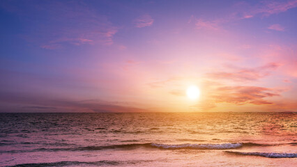 Beautiful sunset sky over on the sea background.