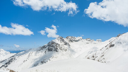 Landscape of snow-capped mountain peak white cloud on blue sky