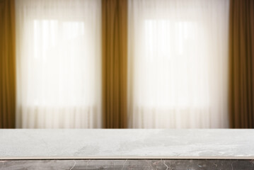 Empty stone table against windows with curtains in room