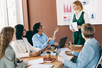 Diverse professionals in a business meeting brainstorming ideas and collaborating in a modern office environment with teamwork.