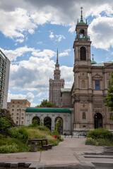 Fototapeta premium All Saints Church, Grzybowski Square Plac Grzybowski . Warsaw, Poland. houses and streets of the city center. Tourist route. Historical landmark. Old and new architecture sight
