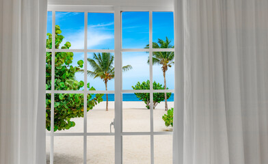 Fototapeta premium Window with a view of palm trees and a beach