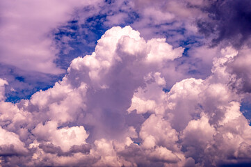 Large cloud filled sky with a blue sky in the background