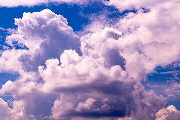Large cloud filled sky with a blue sky in the background