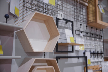 A wooden unique-shaped shelf in a furniture store