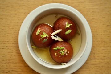 gulab jamun sweet spongy fried indian dessert stacked 