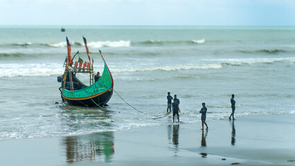 Naklejka premium fishing boat on the beach