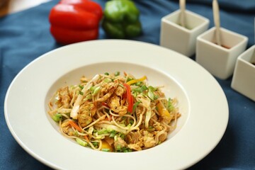 Noodles or chowmein with vegetables in a bowl in a restaurant or cafe