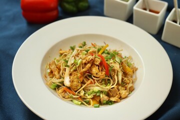 Noodles or chowmein with vegetables in a bowl in a restaurant or cafe