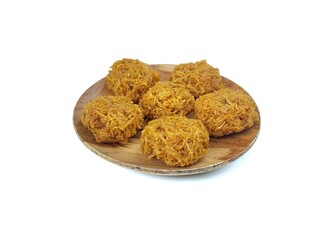 kremes snack on wooden plate or Indonesian snack made from sweet potatoes and palm sugar isolated...