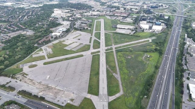 Aerial drone simulates high-altitude approach to Buttonville Airport runway, descending for a close-up landing until coming to a stop
