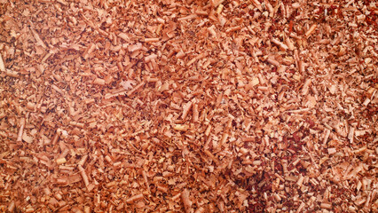 Close-up of sawdust in a furniture manufacturing company, highlights the importance of waste sorting