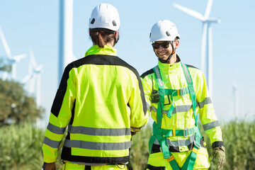Team of electrical engineer is perform the inspection and maintenance of electric generating windmill turbine.