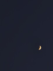 Waxing crescent moon in dark sky astronomy celestial event lunar phase night sky photography...
