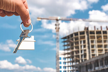 New Home Key with Construction Site Skyline
