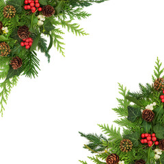 Traditional Christmas winter nature border background with flora of holly, mistletoe berries, ivy,...