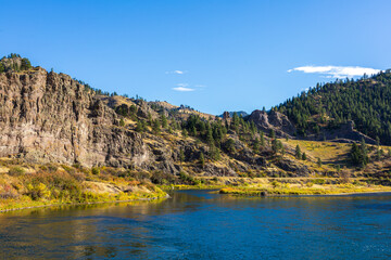 Missouri River flowing through Montana mountains on a sunny day