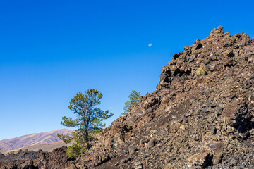 Moon rising over Craters Of The Moon National Monument and Preserve in Idaho