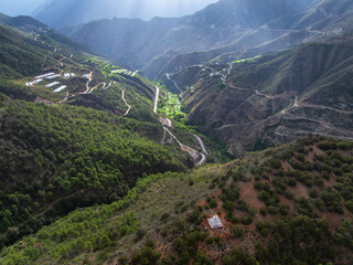 Aerial View of Winding Mountain Roads and Valley