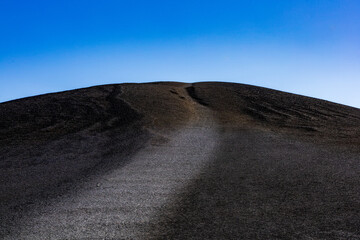 Infertile volcanic landscape creating a black hill at Craters Of The Moon National Monument