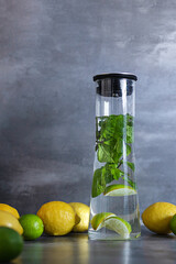Homemade citrus refreshing summer lemonade drink with lemon, lime and mint in mason jars. Taste of summer.  Drinking in the heat