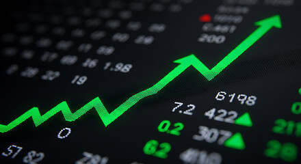 A green upward-trending arrow on a digital stock market screen, indicating positive growth and a bull market. Finance and investment success concept.
