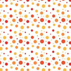 Seamless dots pattern for autumn.Colorful polka dot repeat pattern in orange yellow red isolated on white background.Vector graphic background.