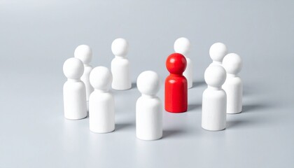 A red figure stands out amongst a group of white figures