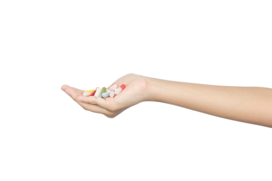 A woman's hand holding a dose of various colorful pills and capsules. Concept of medicine, prescription, and healthcare, isolated on white background with clipping path. - Powered by Adobe