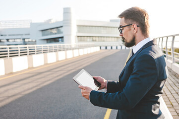 Businessman Standing with Tablet Urban Setting, Technology, Confidence