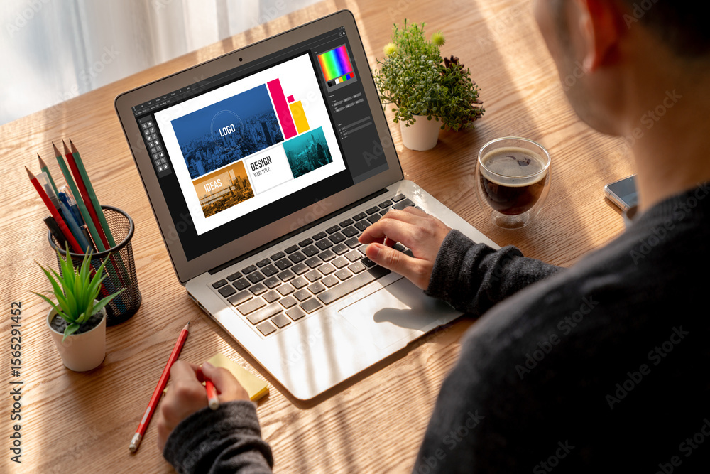 Poster graphic designer software for modern design of web page and commercial ads showing on the computer s
