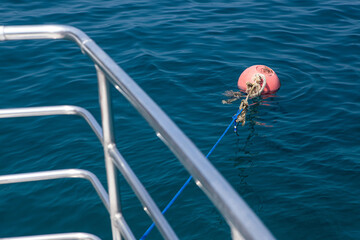 Orange color mooring Buoy floating on the Andaman sea.