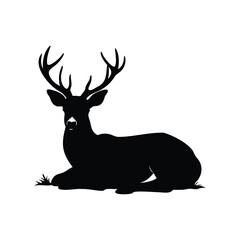 Silhouette of a Majestic Buck Resting on the Ground in Serenity