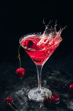 Splash cherry cocktail with vodka and refreshing ingredients