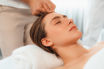 Caucasian woman enjoying relaxing anti-stress head massage and pampering facial beauty skin...