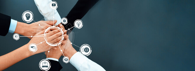 Diverse hands unite in a collaborative gesture, symbolizing teamwork and innovation in a modern...