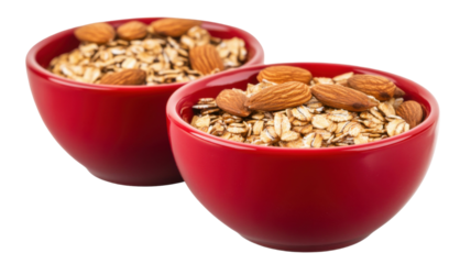 Two red bowls filled with almonds and oats on white background
