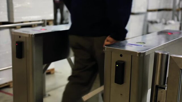 Employee Using Badge for Entry at Industrial Facility Turnstile - Low Angle View - 4K