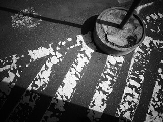 Dramatic light falling on vintage road marking