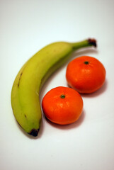 Closeup view of fresh fruit Bananas and Oranges with a small apperture style.