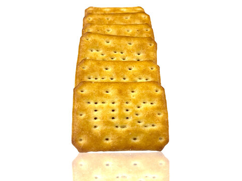 Stack of crispy golden cookies isolated on the white background looking so yummy and delicious