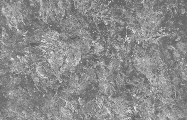 Grey grunge abstract background of distressed acrylic paint textures.