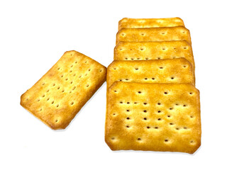 Artistically arranged golden biscuits isolated on the white background