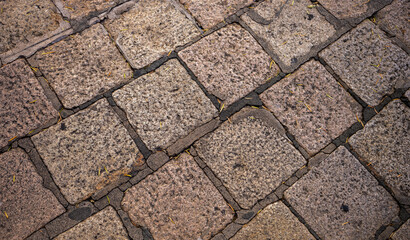 Vintage Hand Laid Cobble Stone Sidewalk in Honolulu Chinatown in the Hawaiian Islands.