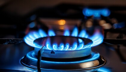 close up of vivid blue flames on a gas stove against a dark background with subtle night lighting high detail commercial shot capturing energy heat and modern kitchen concepts