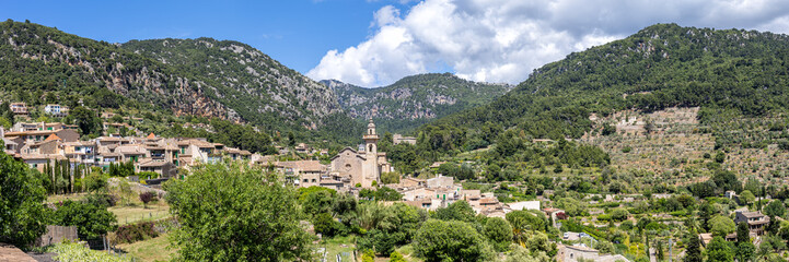 Obraz premium Valldemossa village on Mallorca island with church holiday panorama at Serra de Tramuntana in Spain