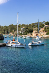 Obraz premium Bay of Cala Figuera on Mallorca island with sailboats holiday by the sea portrait format in Spain