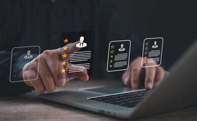 Professional evaluating multiple resumes on a digital interface with star ratings, representing candidate selection, employee evaluation, and recruitment quality analysis through digital platforms.