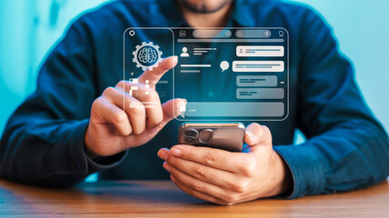 A close-up of hands using a smartphone with a projected dark-themed holographic interface showing icons, chat window, and digital dashboard elements