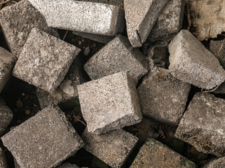 The paving block that will be used for paving the yard are stacked roughly